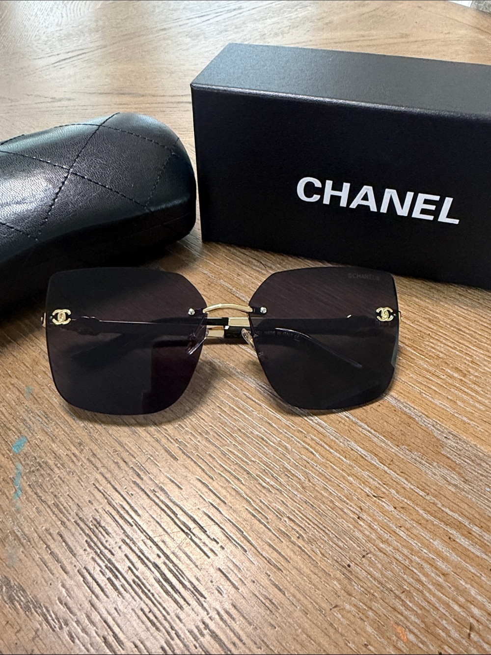 CHANEL Black Rimless Square Sunglasses with Gold Accents